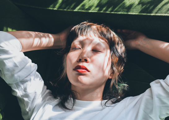 Woman relaxes on her couch